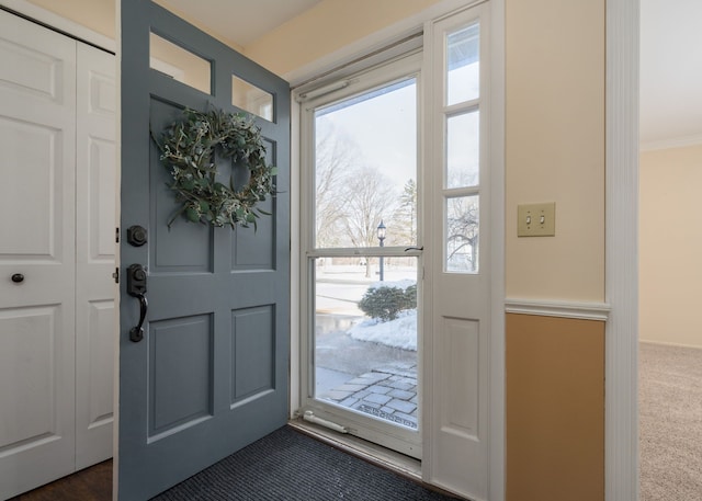 foyer with dark carpet