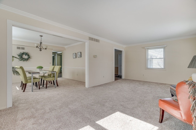 interior space with ornamental molding, visible vents, carpet flooring, and an inviting chandelier