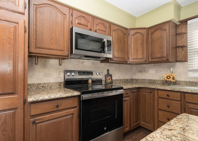 kitchen with open shelves, appliances with stainless steel finishes, light countertops, and backsplash