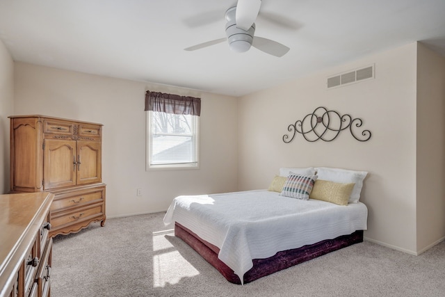 bedroom featuring light colored carpet, visible vents, ceiling fan, and baseboards