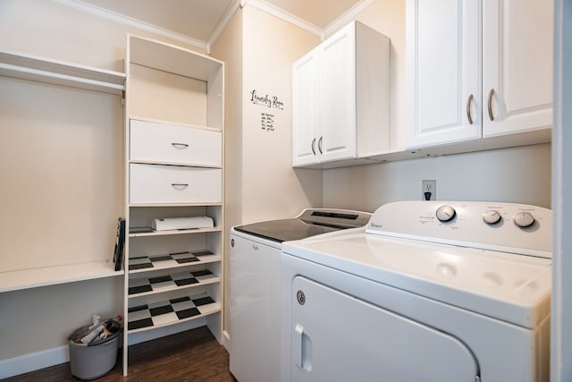 laundry area with dark wood-style floors, washing machine and clothes dryer, cabinet space, ornamental molding, and baseboards