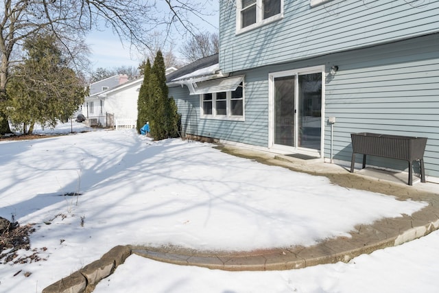 view of yard layered in snow