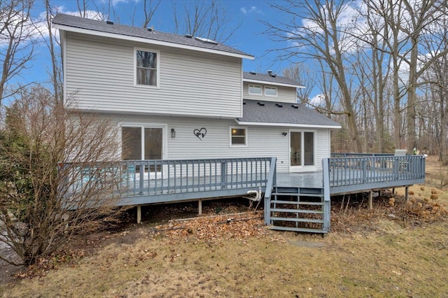 back of house with a wooden deck