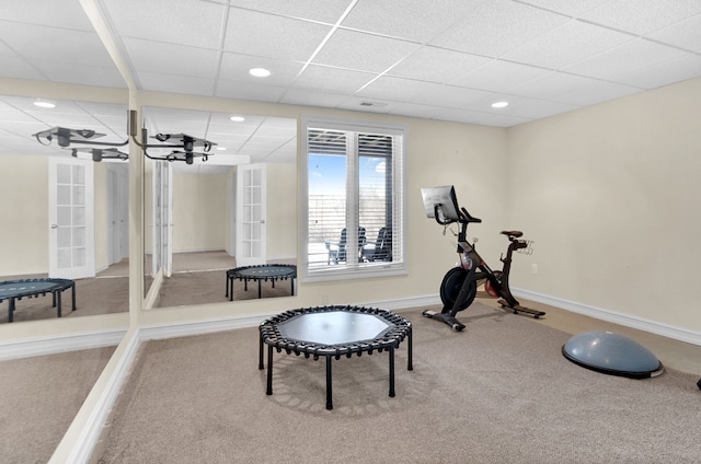 exercise area featuring french doors, a drop ceiling, recessed lighting, and baseboards