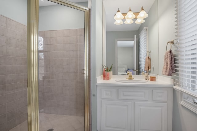 full bathroom featuring a stall shower, vanity, and ensuite bathroom