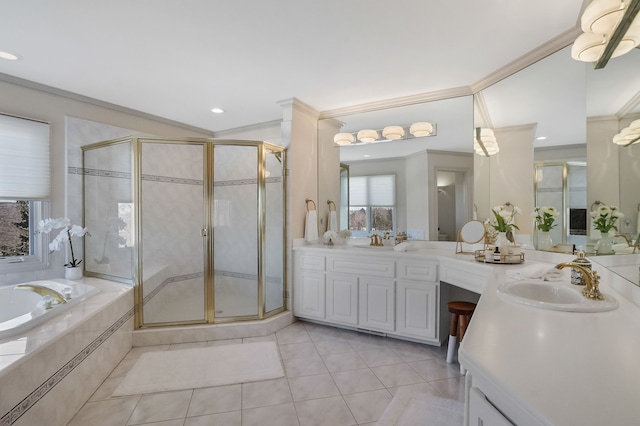 bathroom with a garden tub, tile patterned flooring, a sink, ornamental molding, and a shower stall