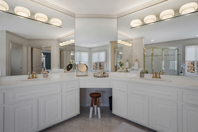 full bath with crown molding, double vanity, a stall shower, a sink, and tile patterned floors