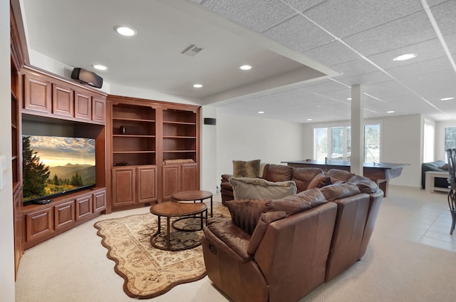 living area with visible vents and recessed lighting