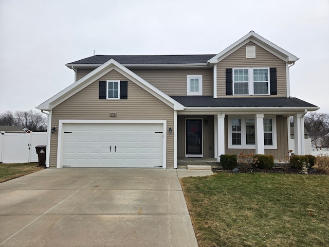 traditional home featuring a gate, fence, driveway, a front lawn, and board and batten siding