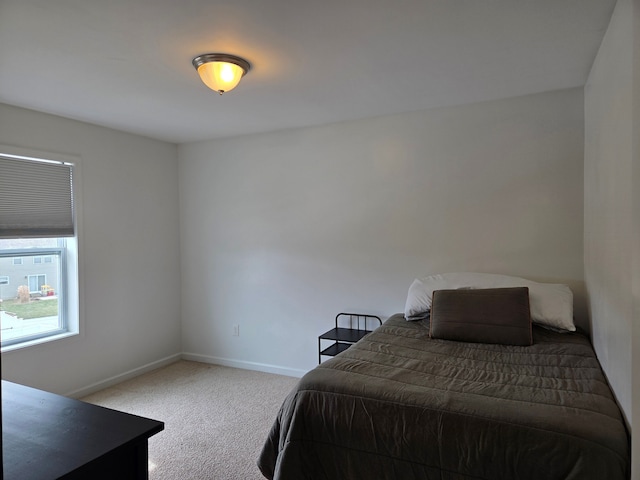 bedroom featuring baseboards and carpet floors