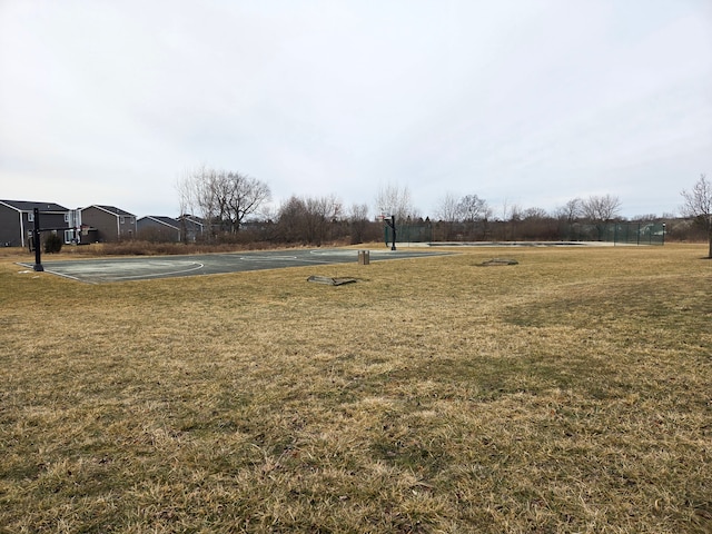 view of yard with community basketball court