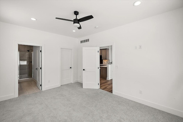 unfurnished bedroom with recessed lighting, visible vents, and carpet flooring