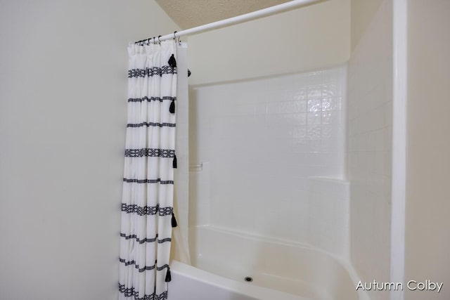 bathroom featuring shower / bath combination with curtain