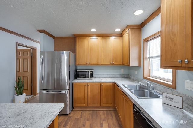 5443 Gravel Ridge Rd, Lakeview, MI 48850 - kitchen with stainless steel appliances, light countertops, a textured ceiling, dark wood finished floors, and crown molding