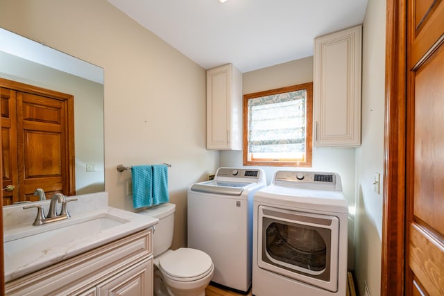 laundry area featuring laundry area, washer and clothes dryer, and a sink