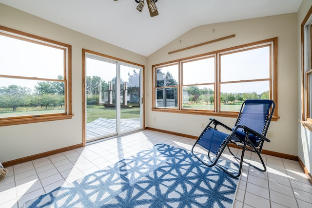 sunroom / solarium featuring lofted ceiling and a ceiling fan