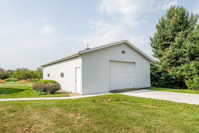 detached garage featuring driveway