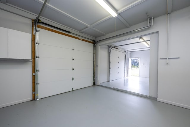 garage featuring baseboards