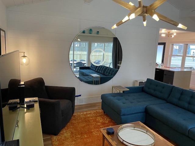 living room with lofted ceiling and dark wood finished floors