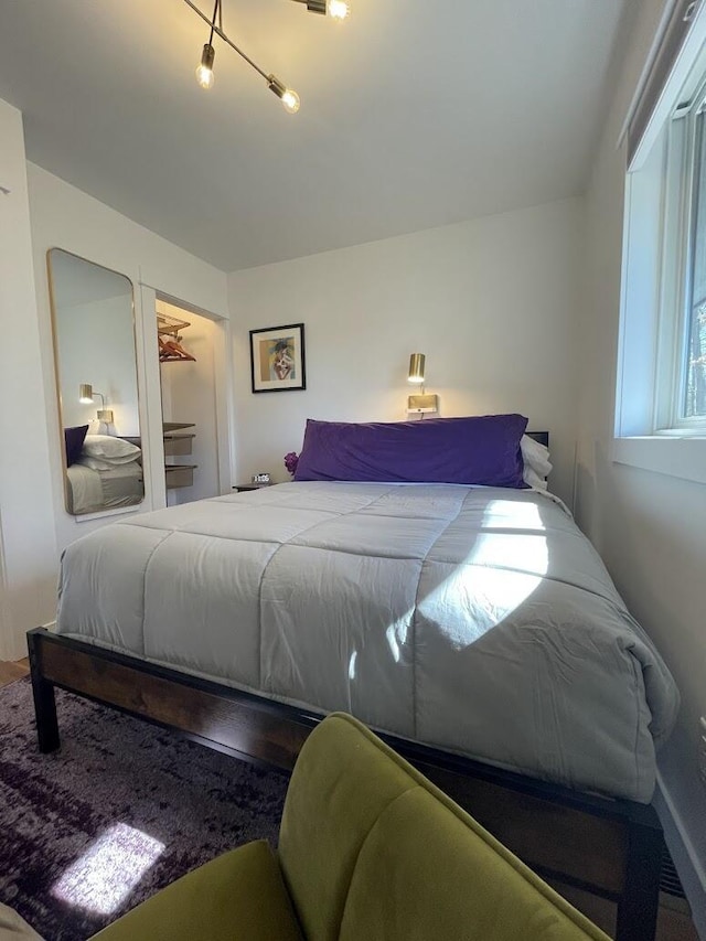 bedroom featuring wood finished floors