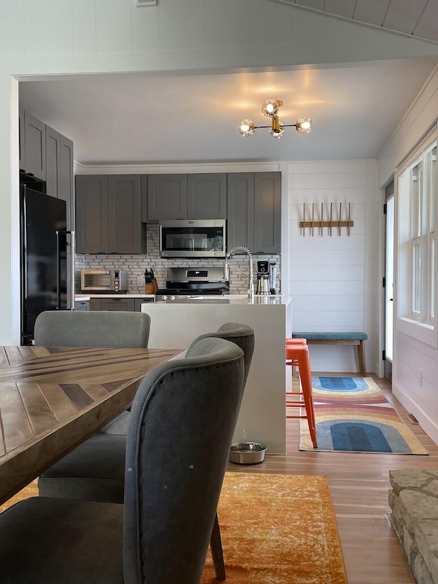 dining area featuring light wood-style flooring