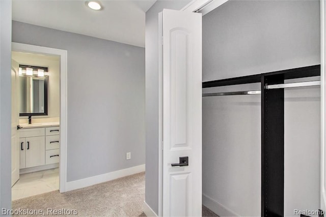 closet featuring a sink