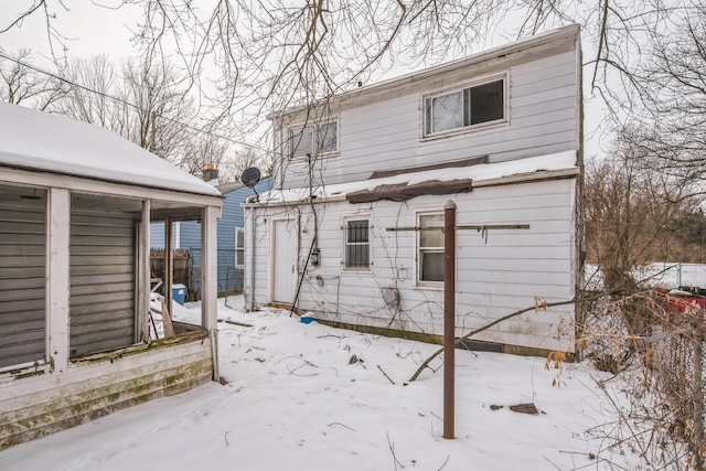 view of snow covered house