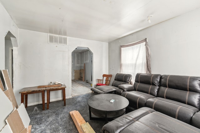 living area with arched walkways and visible vents