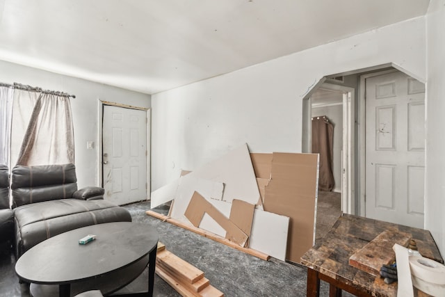 living room with arched walkways