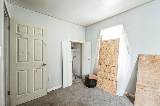 unfurnished bedroom with carpet floors