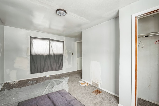 unfurnished bedroom with visible vents and a closet