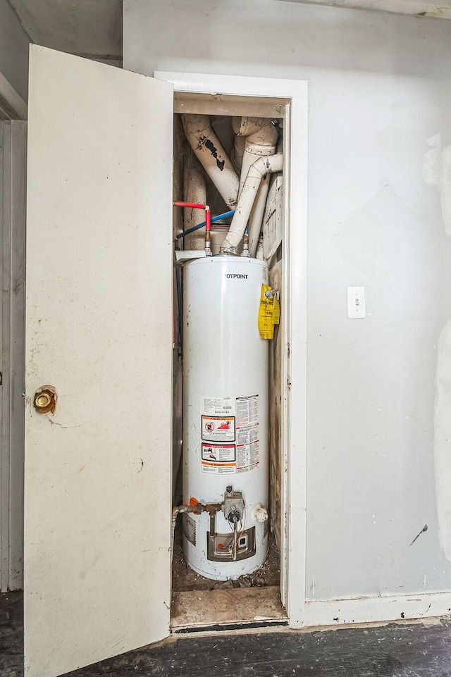 utility room with gas water heater