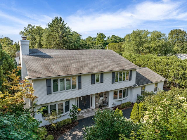 view of front of home with a chimney