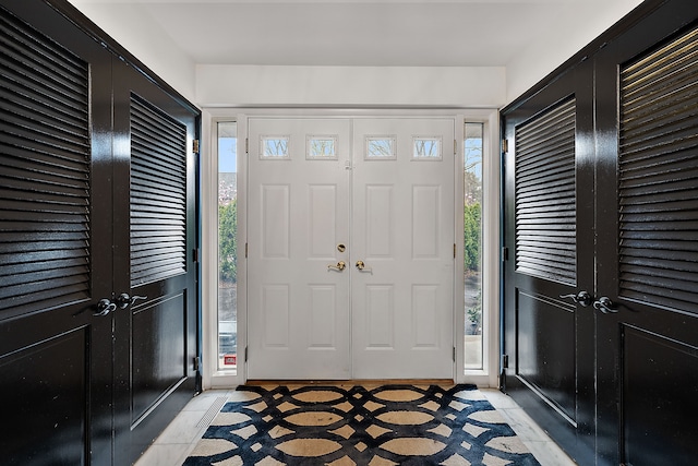 foyer with light tile patterned floors