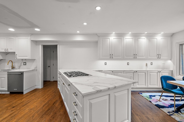 kitchen featuring appliances with stainless steel finishes, recessed lighting, dark wood finished floors, and white cabinets