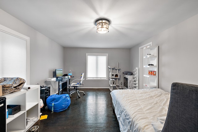 bedroom featuring dark wood finished floors