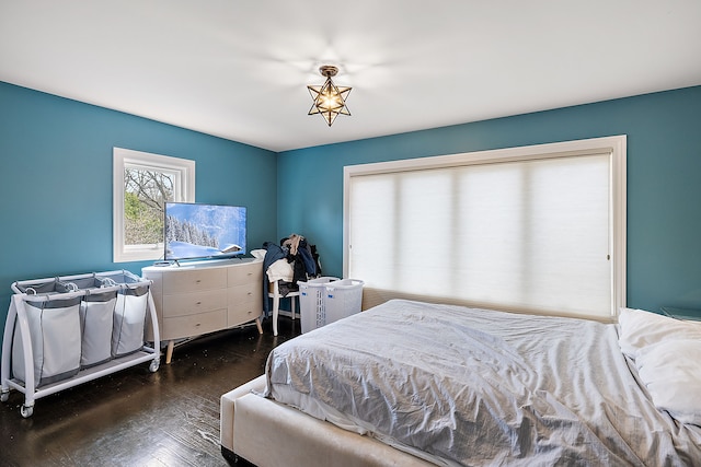 bedroom featuring dark wood-style floors