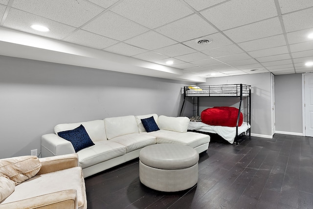 bedroom with a paneled ceiling, recessed lighting, wood finished floors, visible vents, and baseboards