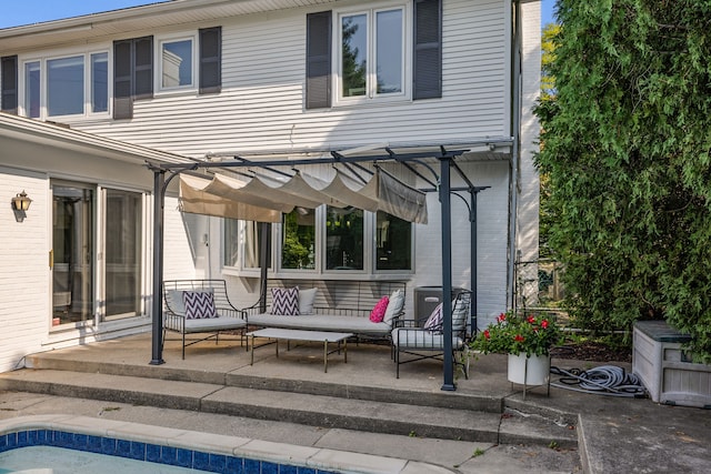 back of house featuring a patio area, an outdoor living space, central AC, and brick siding