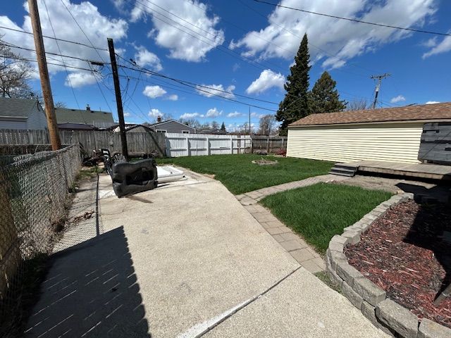 view of yard with a patio and a fenced backyard