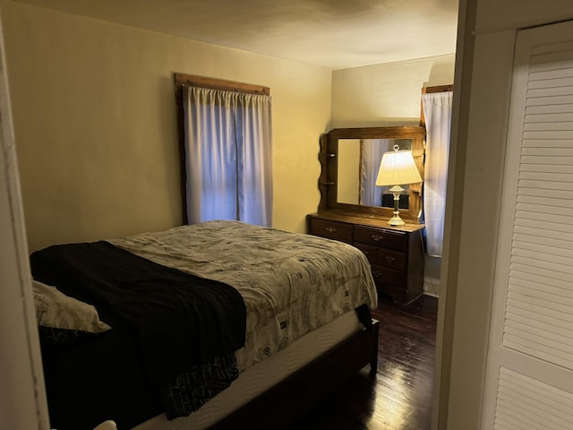 bedroom featuring dark wood-style floors