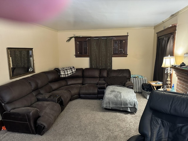 carpeted living room featuring radiator heating unit and a fireplace