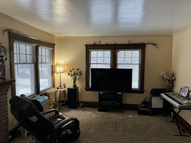 carpeted living room with baseboards and crown molding