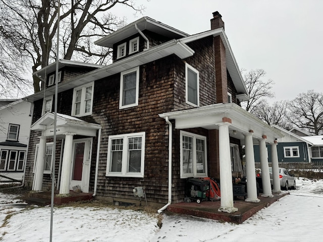 view of front facade with a chimney