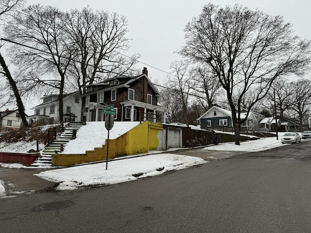 exterior space featuring traffic signs and a residential view