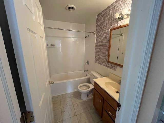 bathroom featuring toilet, vanity, visible vents, shower / bathing tub combination, and tile patterned floors