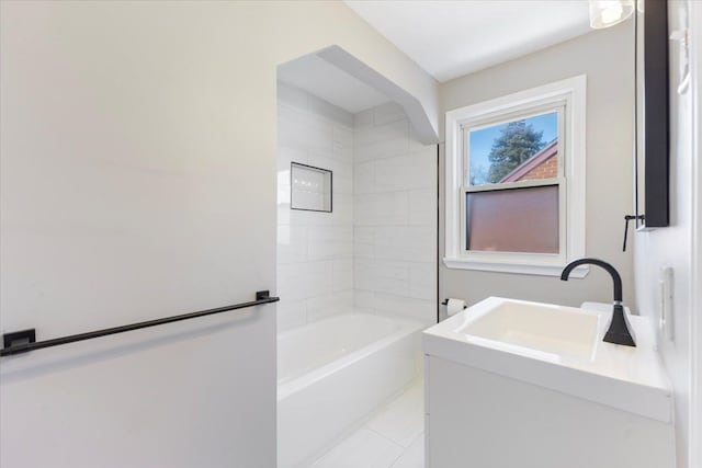 full bath with tub / shower combination, vanity, and tile patterned floors