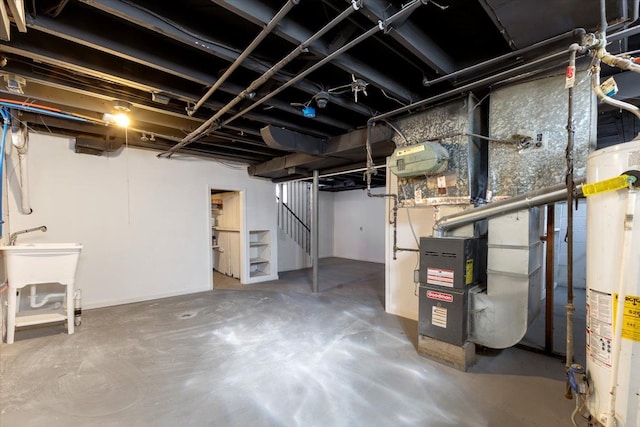 unfinished basement featuring water heater, stairway, and a sink