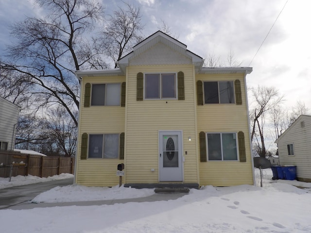 view of front of house featuring fence