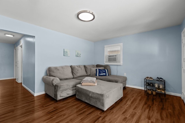 living room with baseboards and wood finished floors